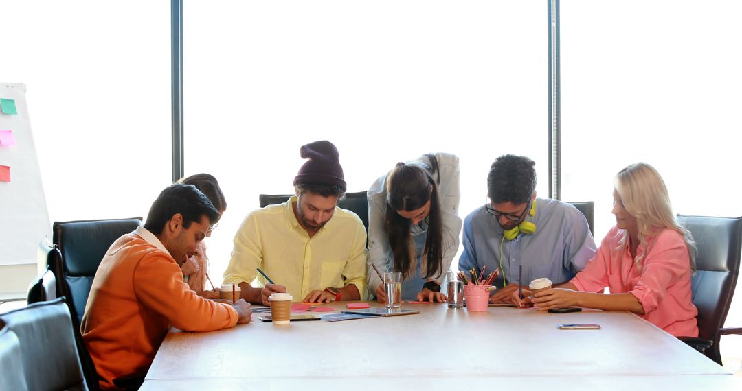 Business Team Collaborating on Creative Project in Conference Room