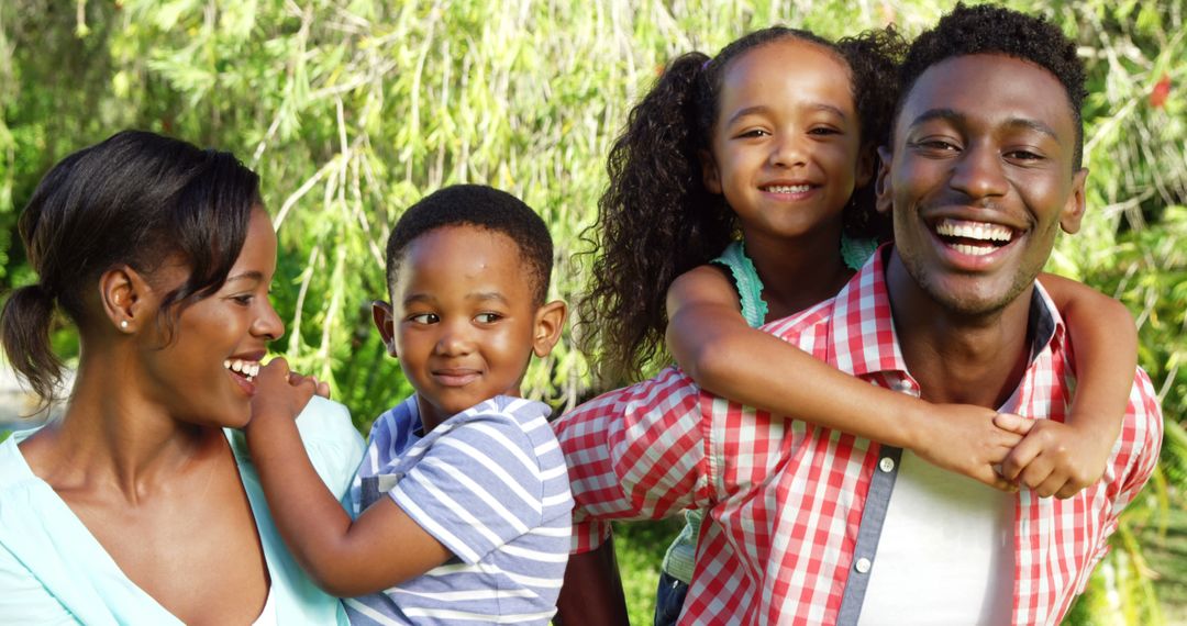 Joyful African American Family Bonding on Sunny Day Outdoors - Free Images, Stock Photos and Pictures on Pikwizard.com