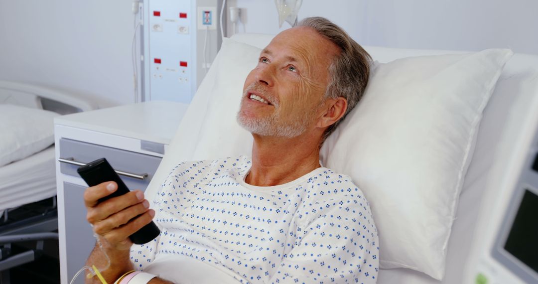 Senior Patient Relaxing in Hospital Bed with Remote Control - Free Images, Stock Photos and Pictures on Pikwizard.com