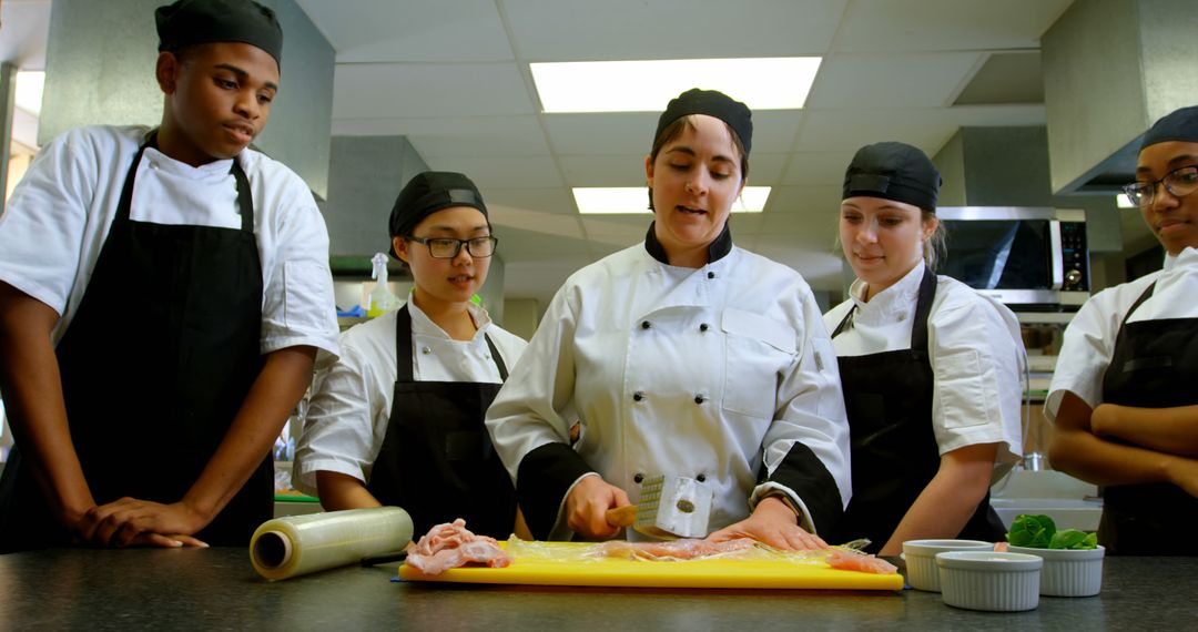 Culinary Students Learning Professional Cooking Techniques - Free Images, Stock Photos and Pictures on Pikwizard.com