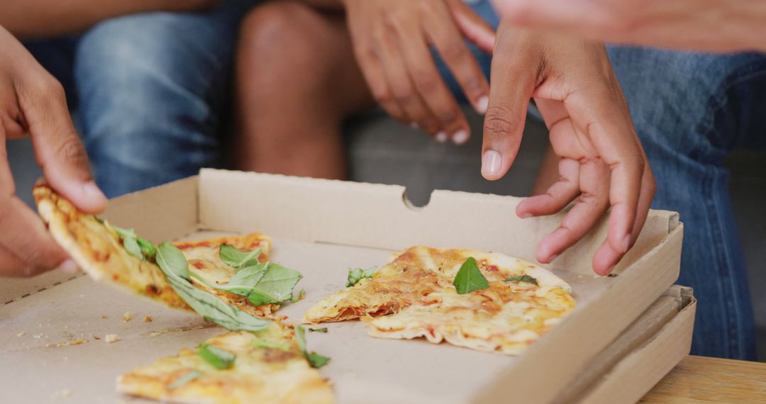 Friends Enjoying Pizza with Toppings in Cardboard Box, Close-up View - Free Images, Stock Photos and Pictures on Pikwizard.com