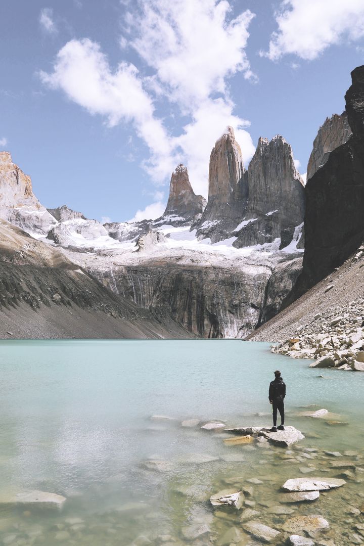 Traveler Admiring Mountain Lake and Towering Peaks - Free Images, Stock Photos and Pictures on Pikwizard.com