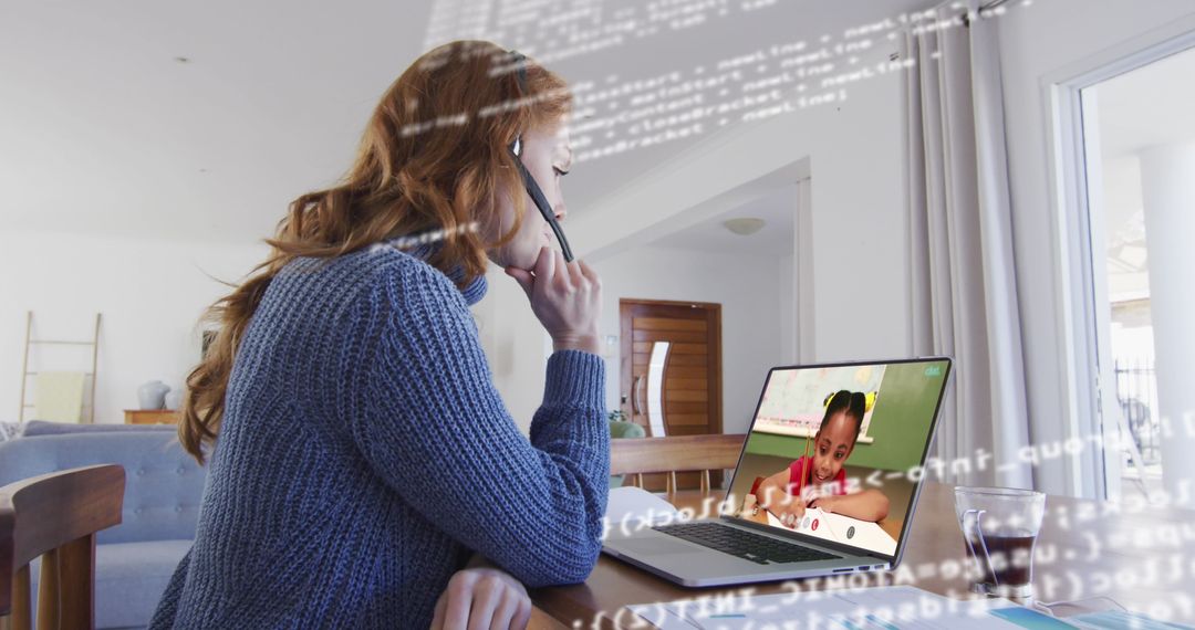 Woman Coding on Laptop During Video Call, Efficient Remote Work
