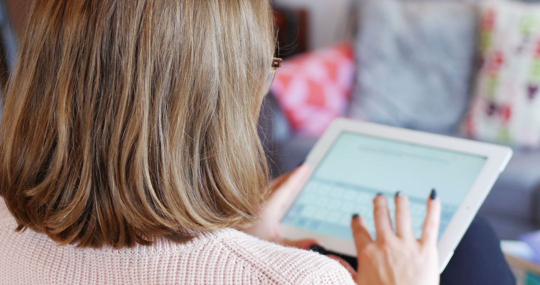 Woman Typing on Tablet with Soft Focus Background - Free Images, Stock Photos and Pictures on Pikwizard.com