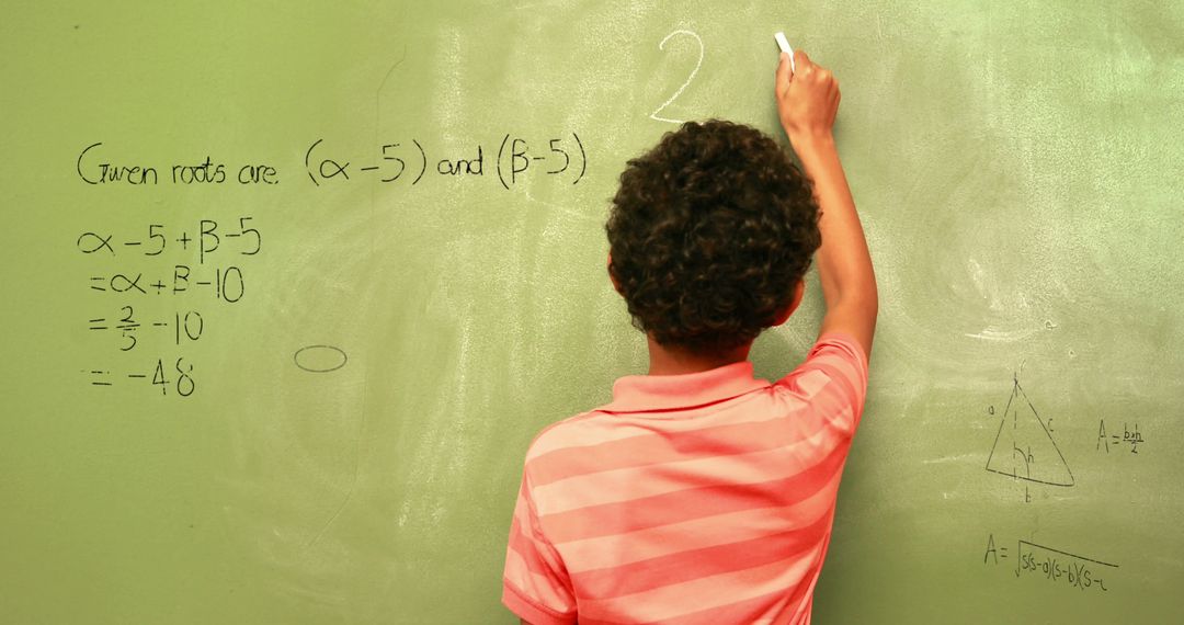 Image of math formulas over back view of biracial boy writing on black board - Free Images, Stock Photos and Pictures on Pikwizard.com