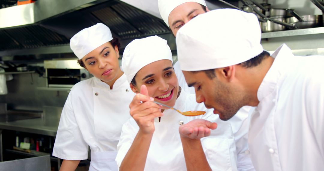 Chefs Tasting Dish Together in Busy Restaurant Kitchen - Free Images, Stock Photos and Pictures on Pikwizard.com