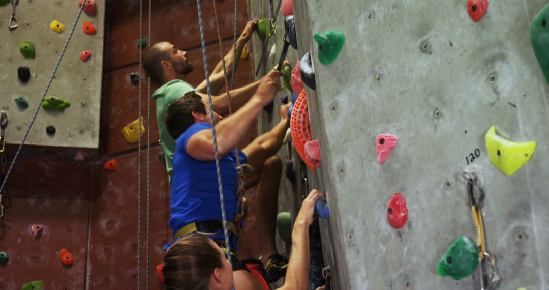 Group of Friends Enjoying Indoor Rock Climbing Together - Free Images, Stock Photos and Pictures on Pikwizard.com