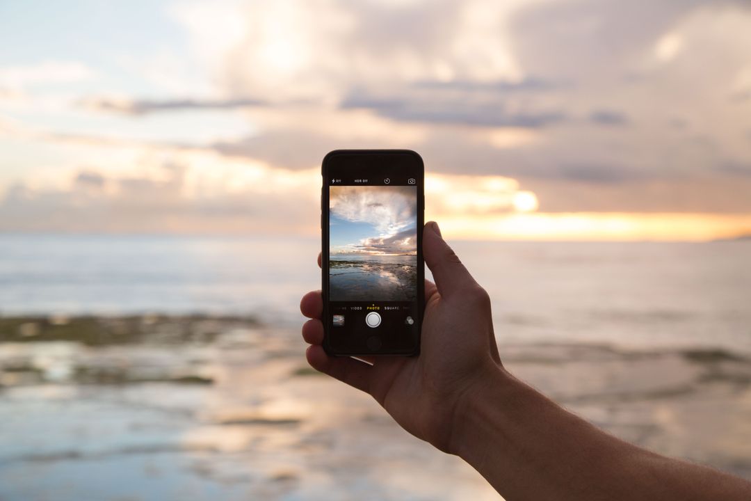 Capturing Sunset Over Ocean with Smartphone - Free Images, Stock Photos and Pictures on Pikwizard.com