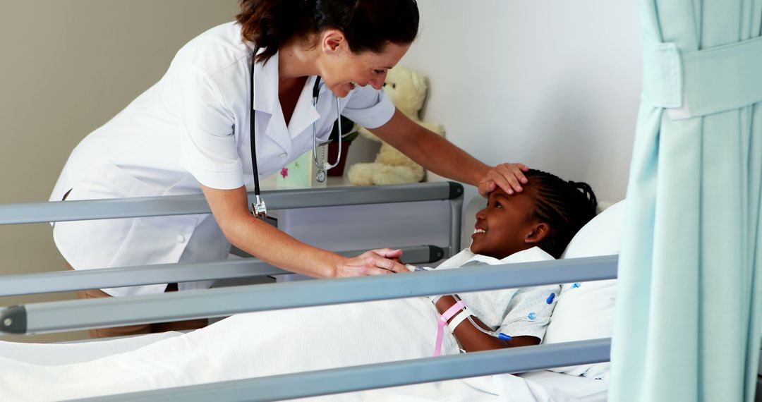 Female Nurse Comforting African American Child in Hospital Bed - Free Images, Stock Photos and Pictures on Pikwizard.com