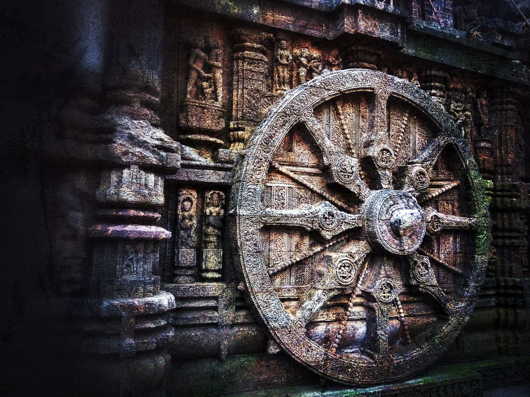 Ancient Stone Carving Featuring Intricate Wheel Design