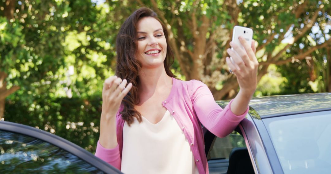 Woman Taking Selfie Next to Car in Outdoor Setting - Free Images, Stock Photos and Pictures on Pikwizard.com