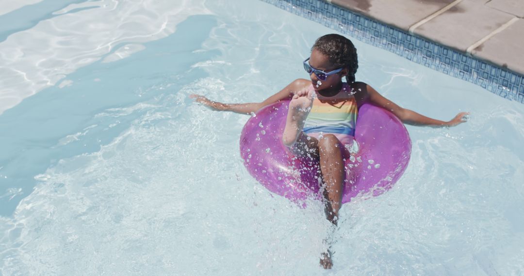 Young Girl Relaxing on Inflatable Ring in Swimming Pool - Free Images, Stock Photos and Pictures on Pikwizard.com