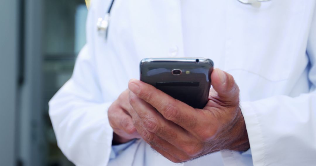 Doctor Using Smartphone for Medical Information - Free Images, Stock Photos and Pictures on Pikwizard.com