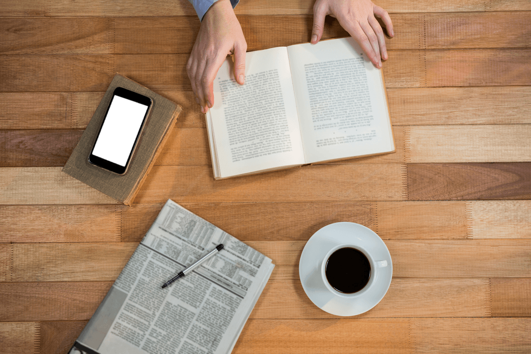 Transparent Workspace with Book, Coffee, and Mobile Phone