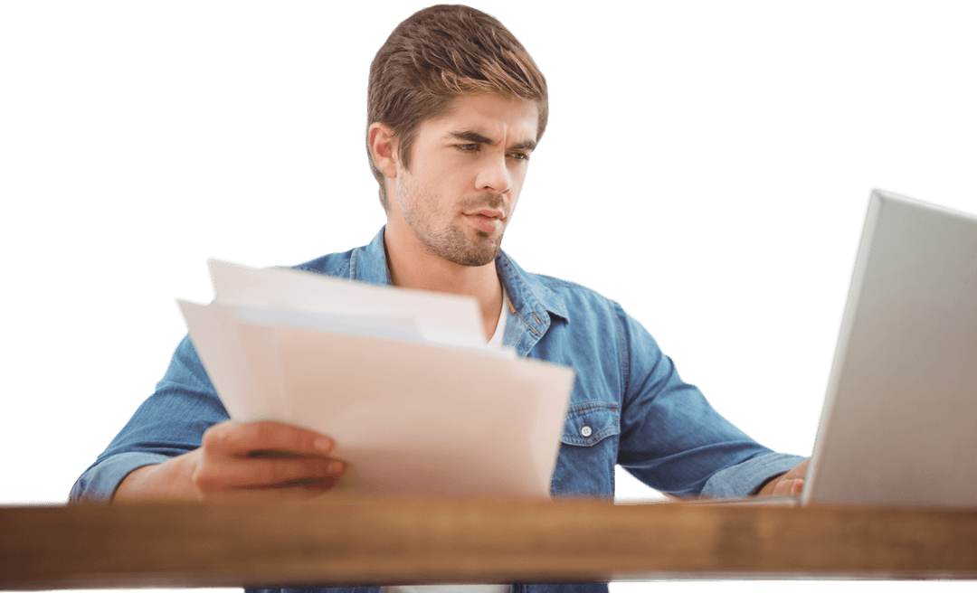 Focused Young Professional Reviewing Documents with Laptop Transparent Background
