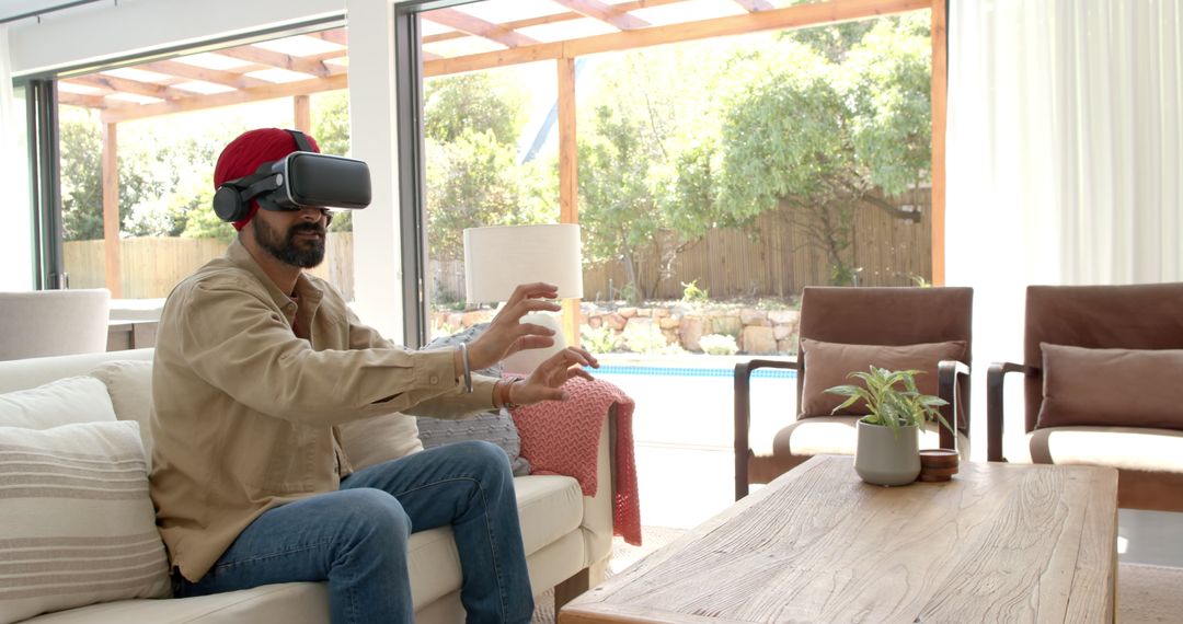 Man Engaging with Virtual Reality Headset in Modern Living Room