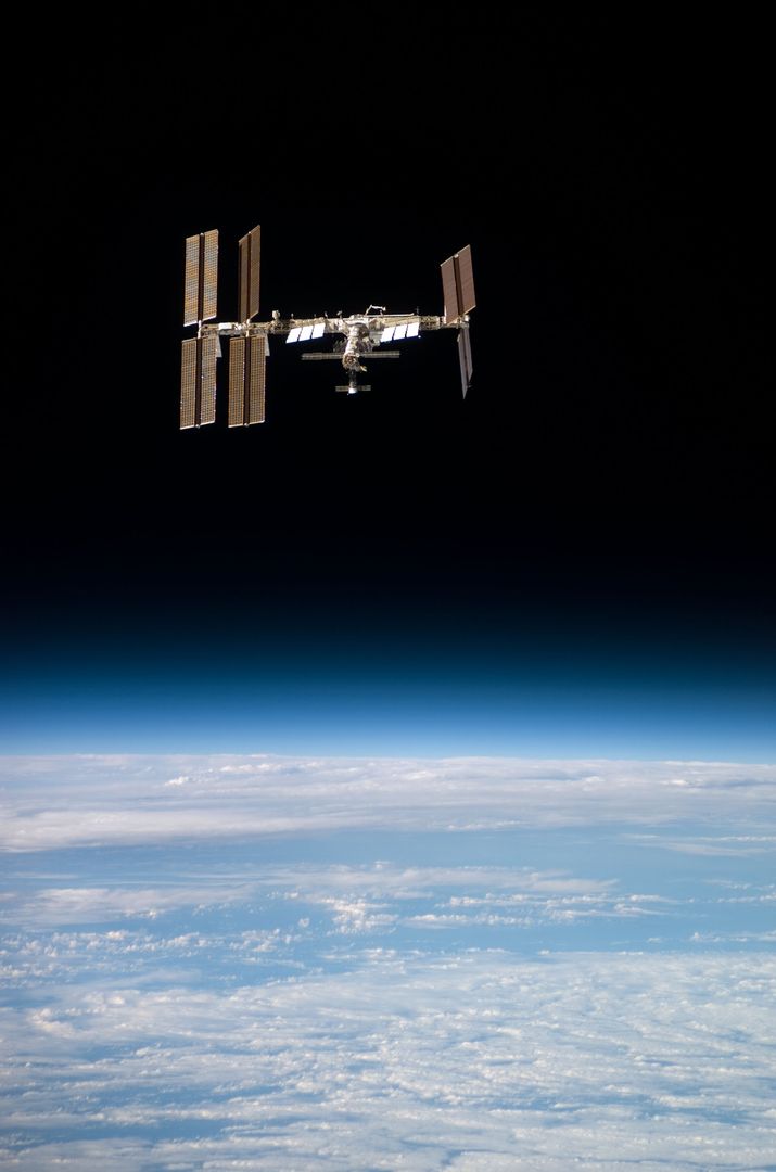 Flyaround view of the ISS taken from STS-123 Space Shuttle Endeavor - Free Images, Stock Photos and Pictures on Pikwizard.com