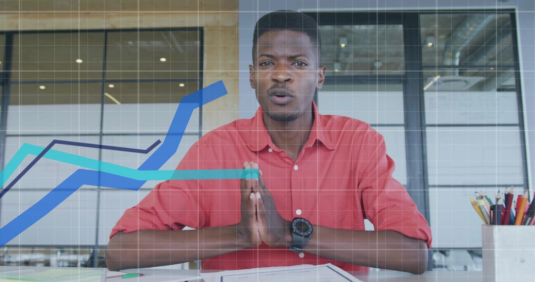 Focused Business Analysis with Digital Chart Overlay in Modern Office