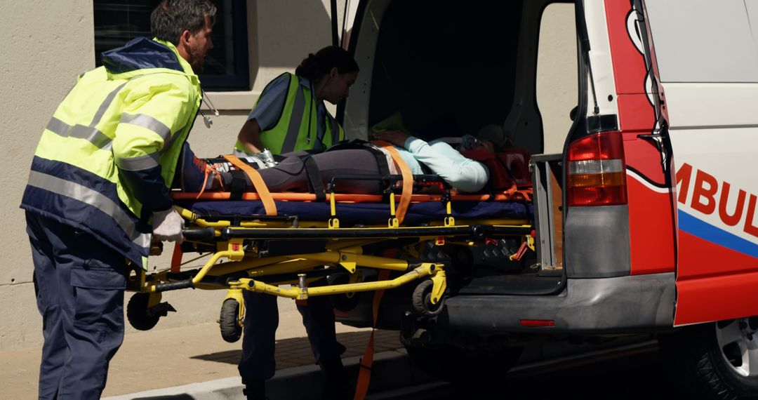 Paramedics Loading Patient into Ambulance on Stretcher - Free Images, Stock Photos and Pictures on Pikwizard.com