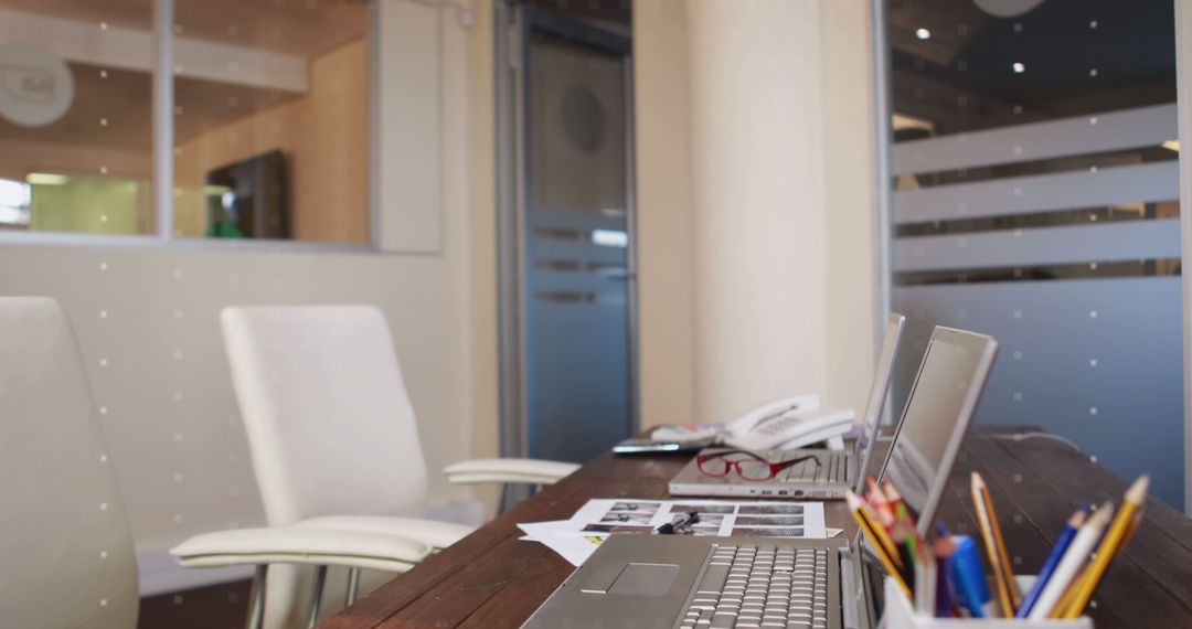 Modern Office with Laptops and Global Digital Network Overlay