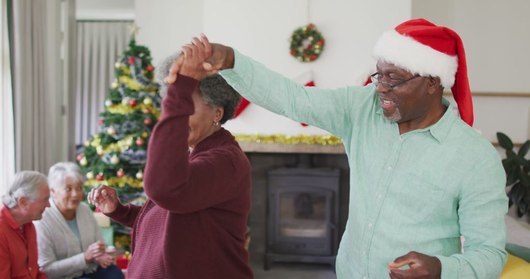 Elderly Couple Dancing at Christmas Celebration - Free Images, Stock Photos and Pictures on Pikwizard.com