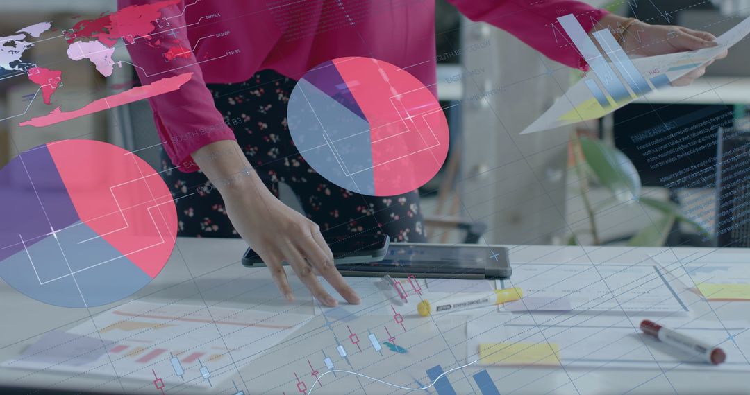 Businesswoman Analyzing Data with Digital Graphs and Blueprints