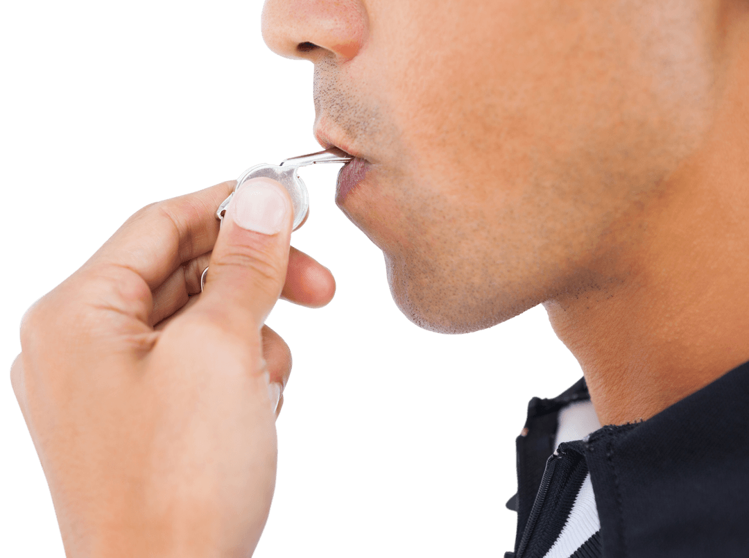Close-up of Referee In Action Blowing Whistle Transparent Background