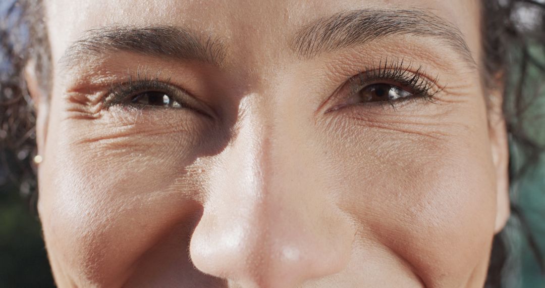 Close-Up of Biracial Woman's Joyful Eyes on Sunny Day - Free Images, Stock Photos and Pictures on Pikwizard.com