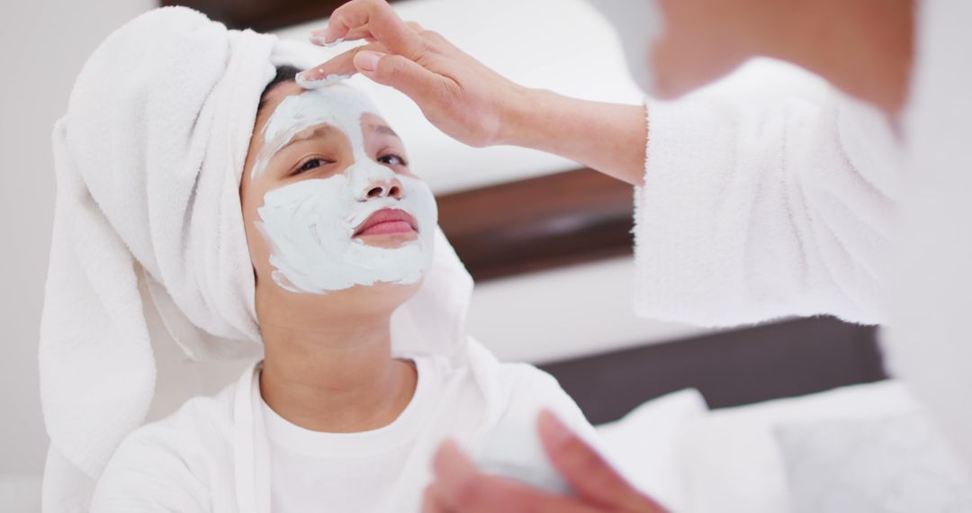 Mother and Daughter Enjoy Relaxing Face Mask at Home