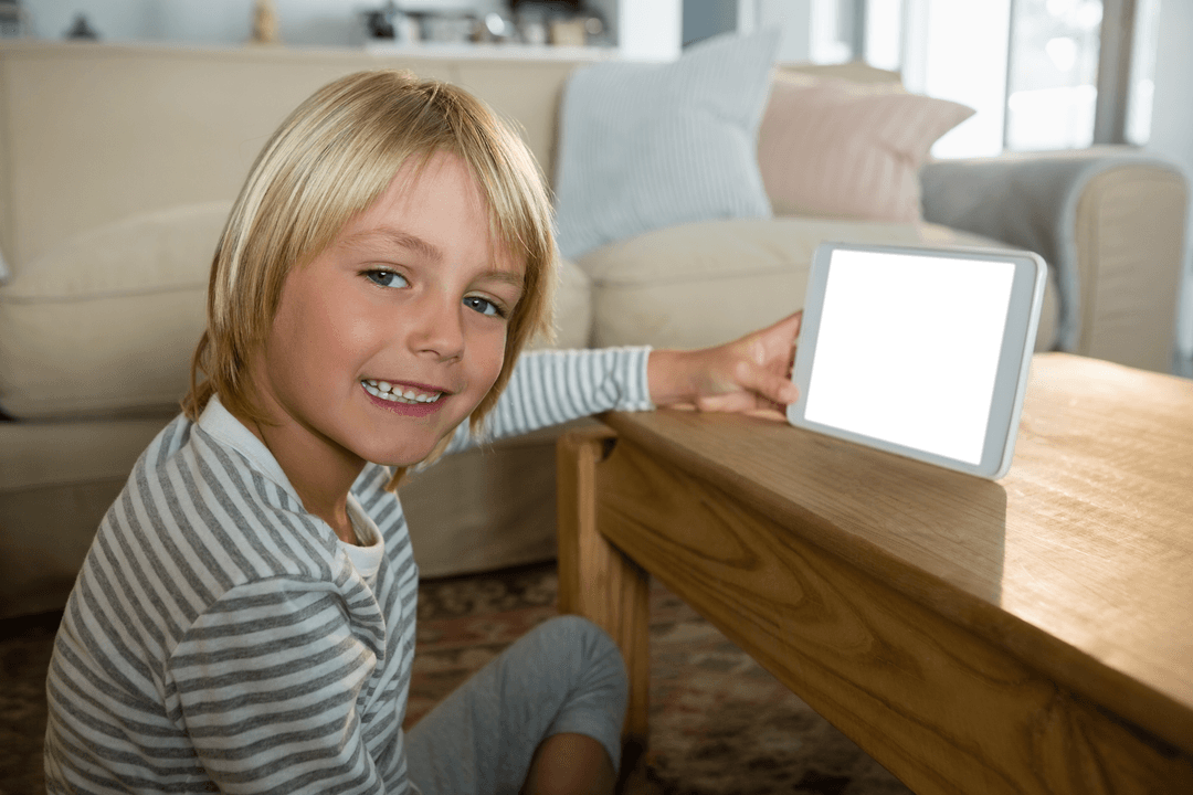Smiling Child Presenting Tablet with Transparent Screen Indoors