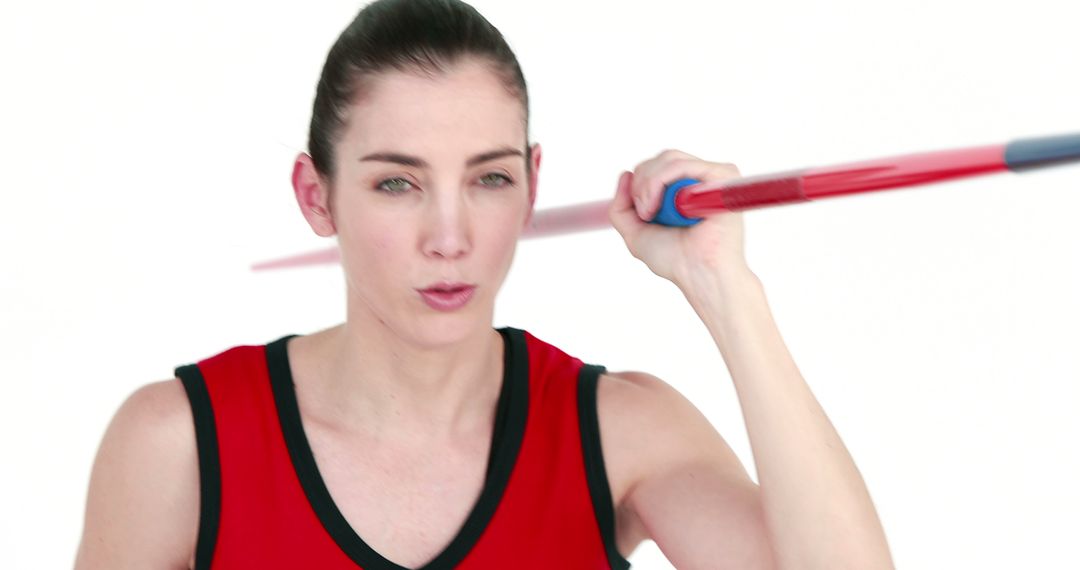 Female Athlete Holding Javelin with Focused Pose