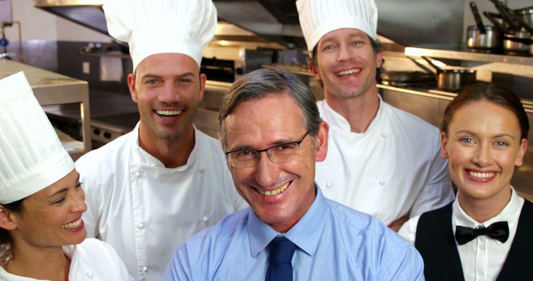 Culinary Team Smiling in Professional Kitchen - Free Images, Stock Photos and Pictures on Pikwizard.com