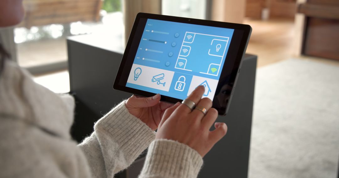 Woman Operates Smart Home System on Tablet