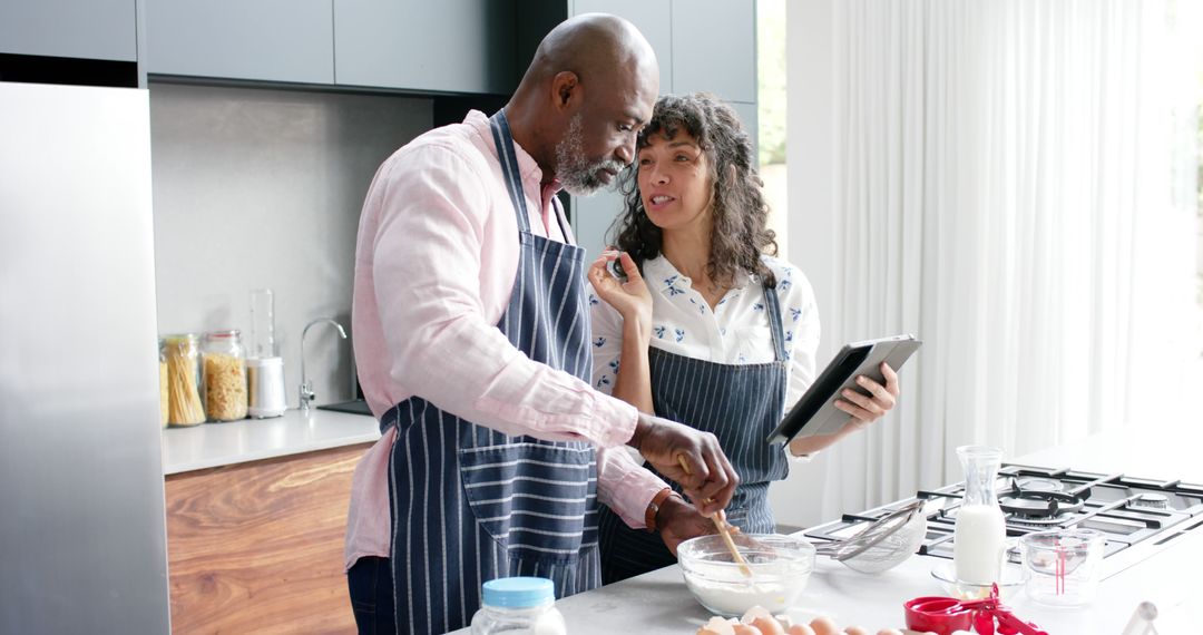 Couple Cooking Together in Modern Kitchen with Tablet - Free Images, Stock Photos and Pictures on Pikwizard.com