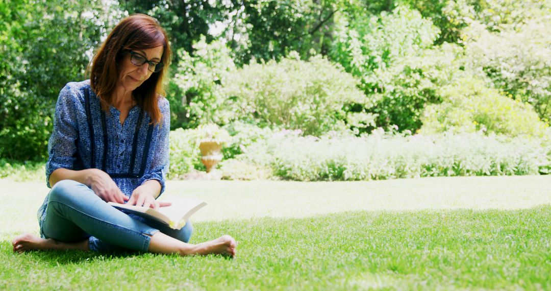 Woman Reading Book in Sunny Garden - Free Images, Stock Photos and Pictures on Pikwizard.com