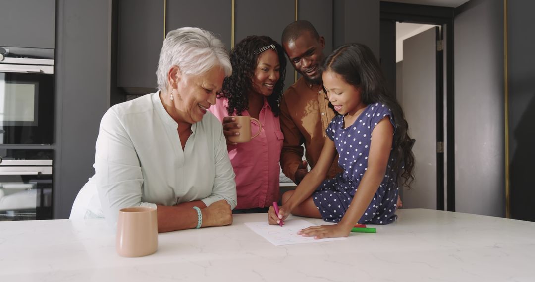 Multigenerational Family at Kitchen Island Smiling While Child Drawing with Marker