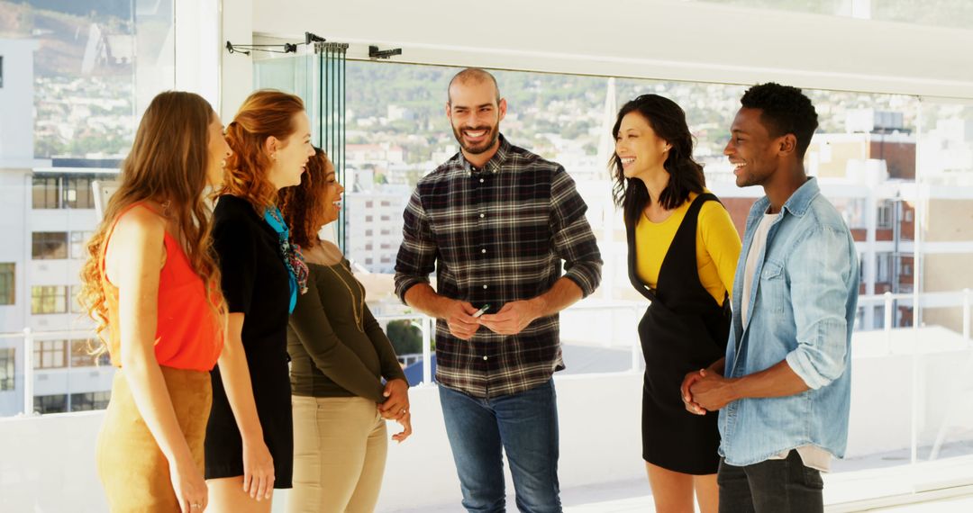 Diverse Group Engaged in Friendly Conversation Indoors