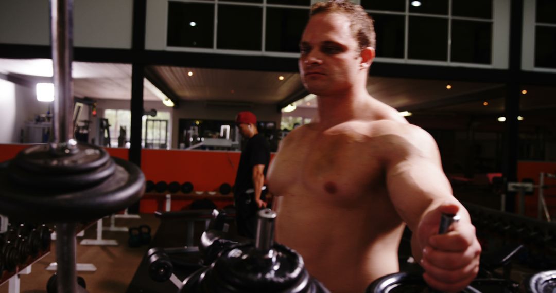 Determined Muscular Man Training in Modern Gym - Free Images, Stock Photos and Pictures on Pikwizard.com