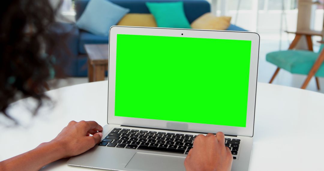 Person Typing on Laptop with Green Screen in Modern Office - Free Images, Stock Photos and Pictures on Pikwizard.com