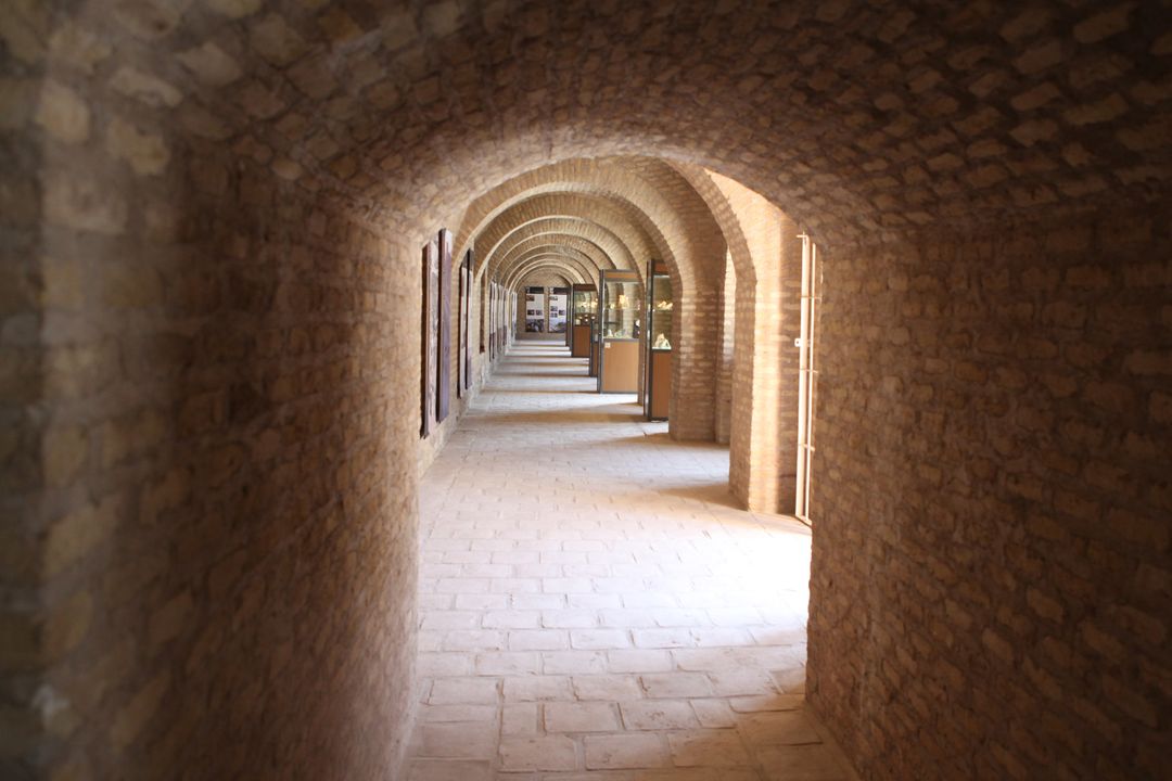 Historic Brick Archway Corridor with Symmetrical Design - Free Images, Stock Photos and Pictures on Pikwizard.com