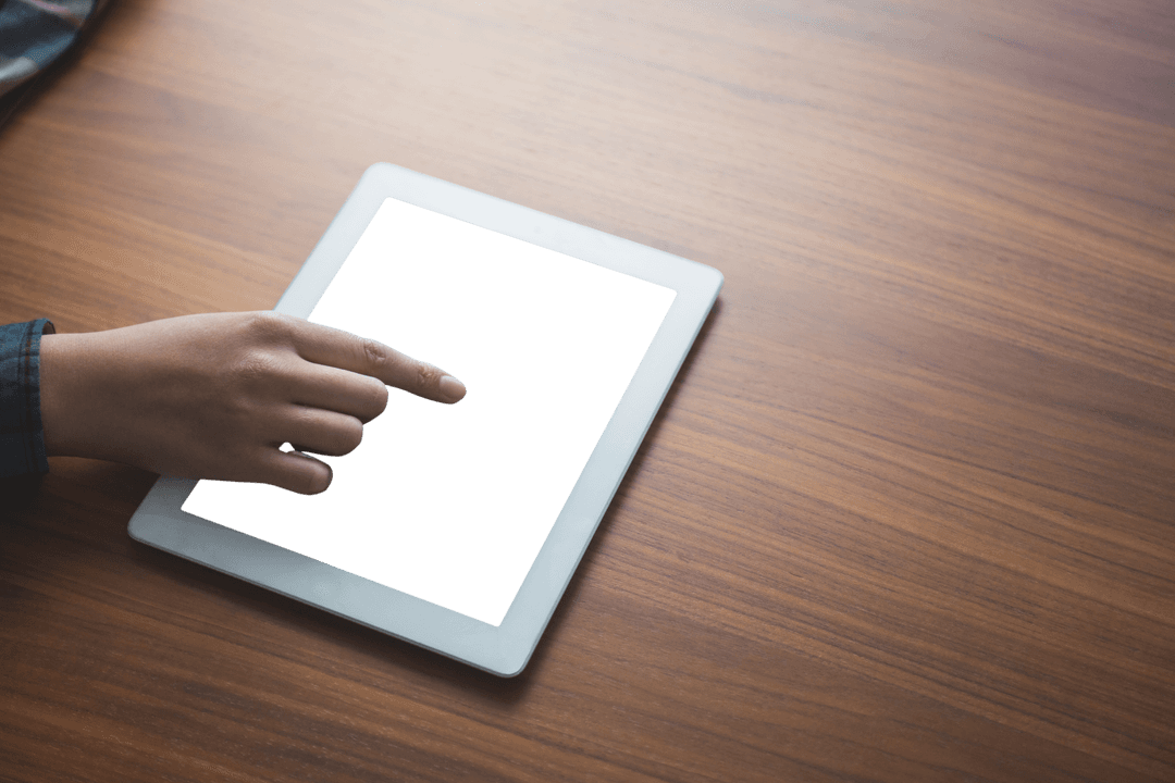 Hand Using Transparent Tablet On Wooden TableTop