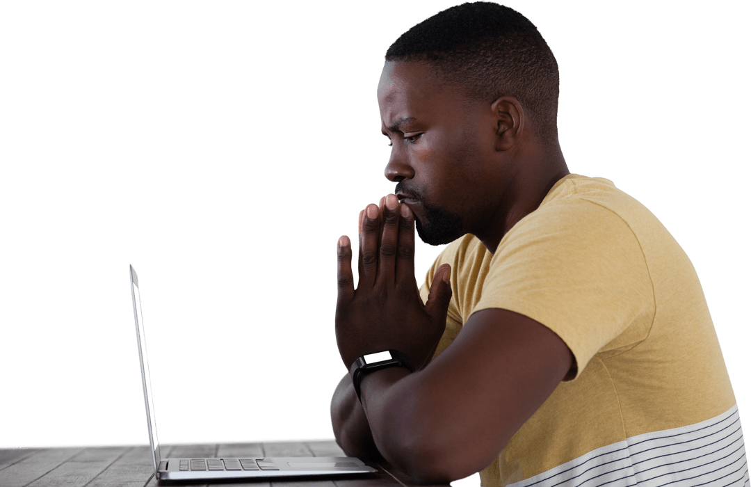 Focused Man Sitting at Table with Laptop, Transparent Background