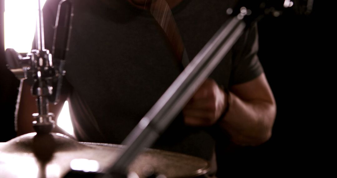 Musician Playing Drums in Dark Studio - Free Images, Stock Photos and Pictures on Pikwizard.com