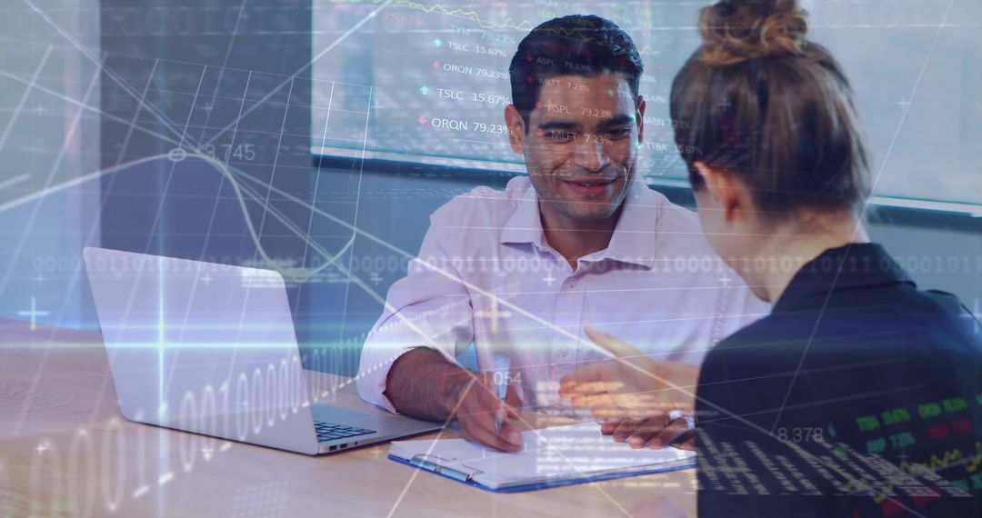 Business Team Analyzing Data with Laptop and Charts Overlay