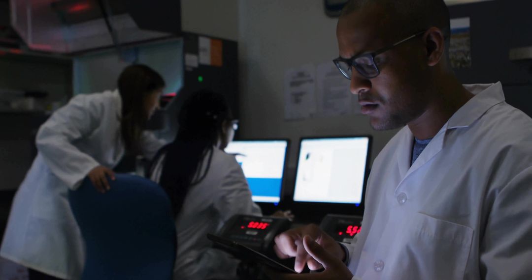 Scientist Analyzing Data on Tablet in High-Tech Control Room