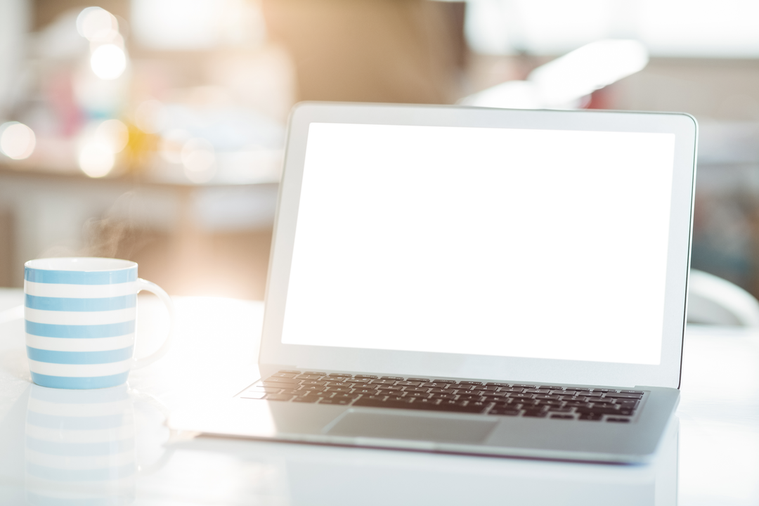 Transparent Screen Laptop with Coffee Mug in Cozy Office - Download Free Stock Images Pikwizard.com