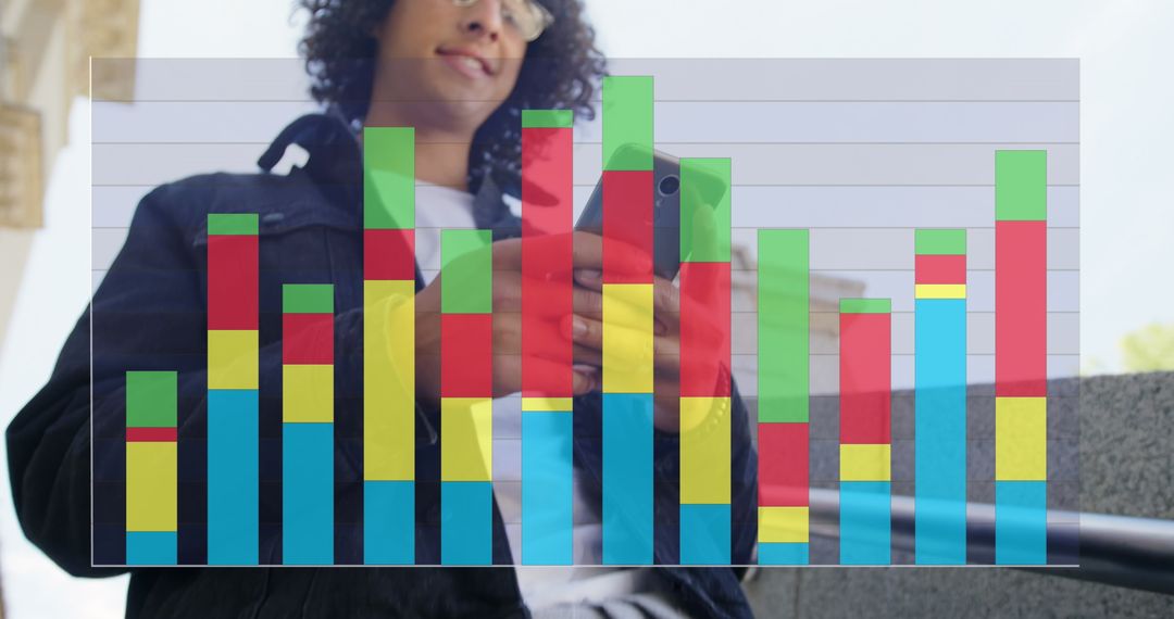 Smiling Man Engaging with Digital Business Graphs on Smartphone