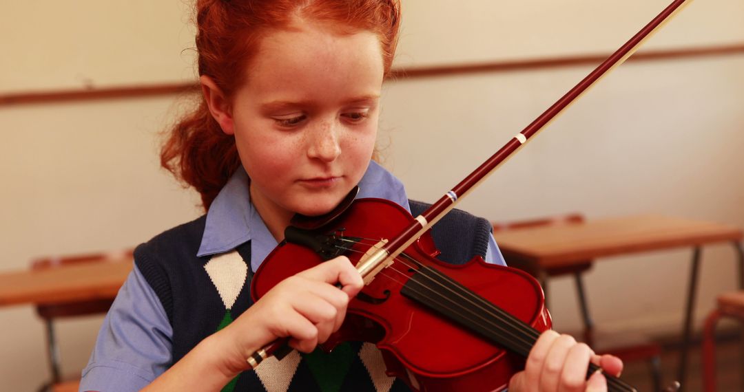 Young Girl Practicing Violin in Classroom - Free Images, Stock Photos and Pictures on Pikwizard.com