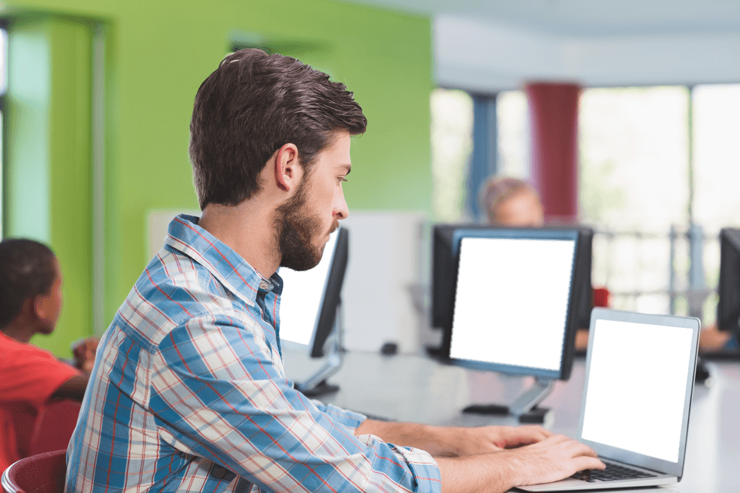 Educator Engaging with Laptop in Modern Classroom