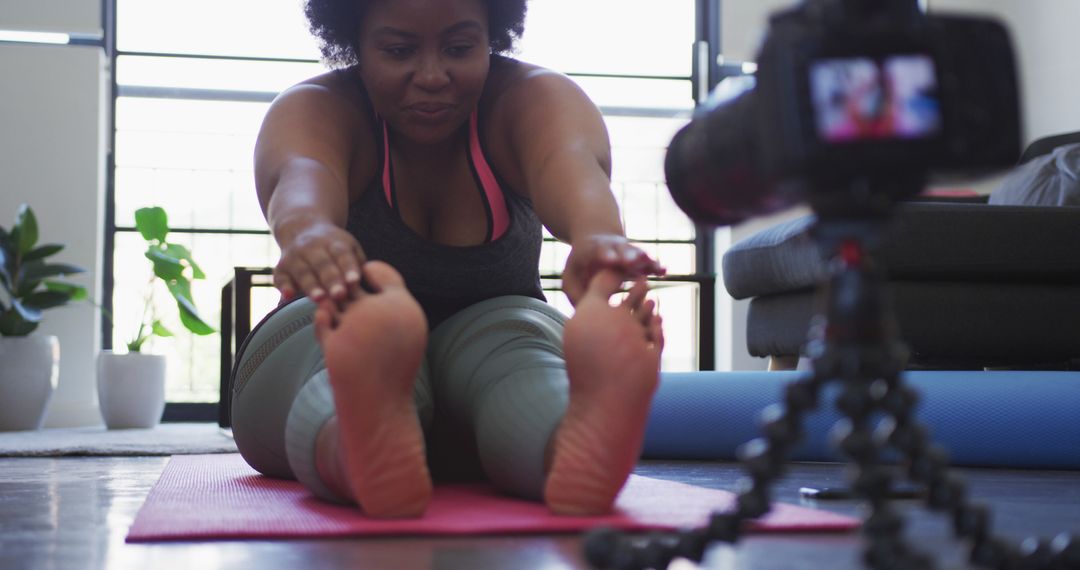 African American Woman Stretching During Online Yoga Class at Home - Free Images, Stock Photos and Pictures on Pikwizard.com